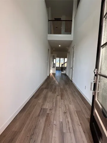 a view of entryway with wooden floor