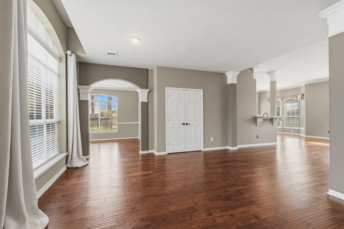 3403 Marywood Drive Spring, TX 77388 - Photo 11 of 50 a view of an empty room with wooden floor and a window