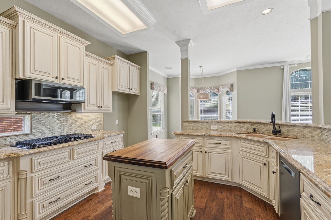 3403 Marywood Drive Spring, TX 77388 - Photo 14 of 50 a kitchen with granite countertop a sink stove and cabinets