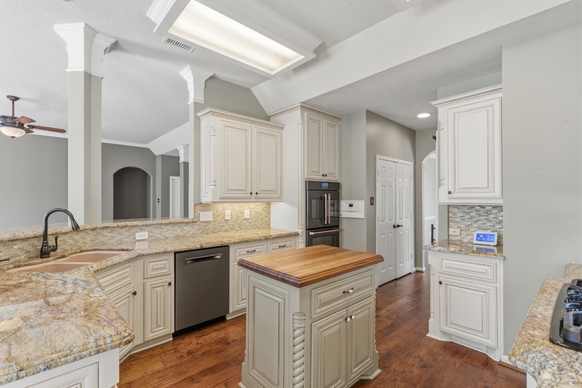 3403 Marywood Drive Spring, TX 77388 - Photo 16 of 50 a kitchen with a sink stove and refrigerator