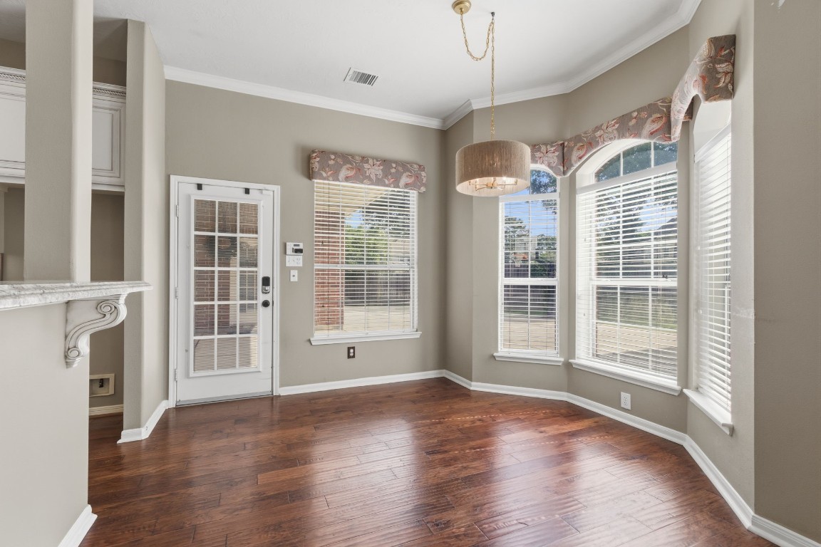 3403 Marywood Drive Spring, TX 77388 - Photo 19 of 50 a view of an empty room with wooden floor and a window