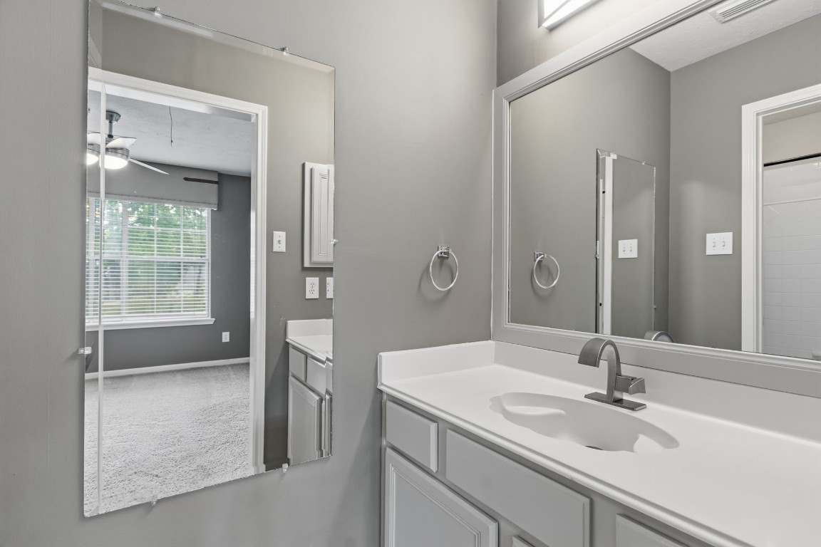 3403 Marywood Drive Spring, TX 77388 - Photo 31 of 50 a bathroom with a sink a toilet and shower