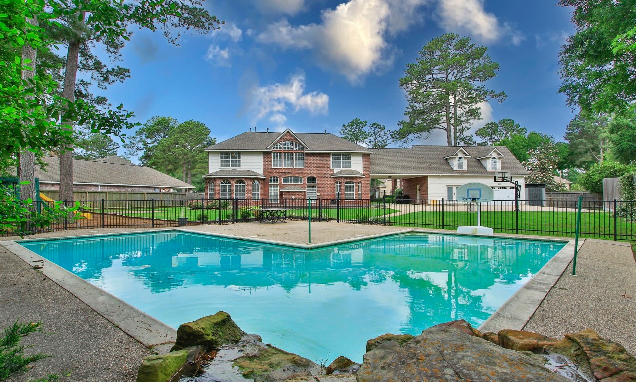 3403 Marywood Drive Spring, TX 77388 - Photo 42 of 50 a view of a house with swimming pool and a yard