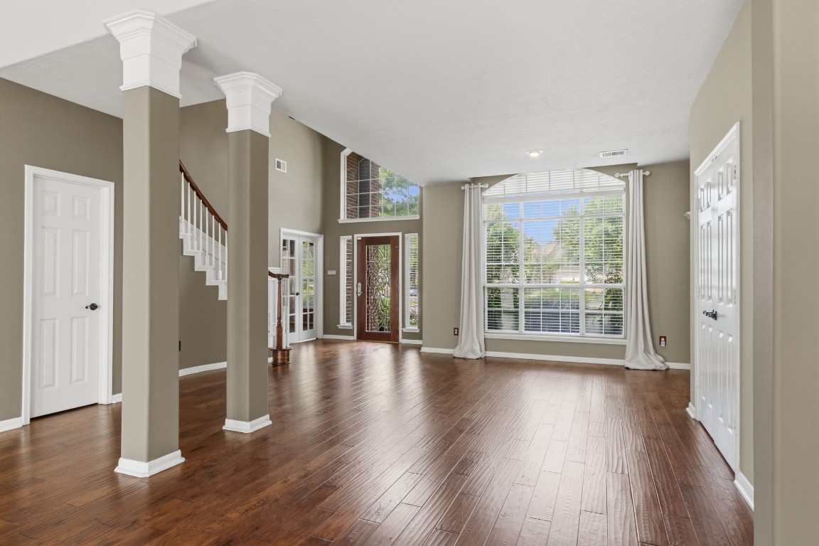 3403 Marywood Drive Spring, TX 77388 - Photo 8 of 50 a view of an empty room with wooden floor and a window