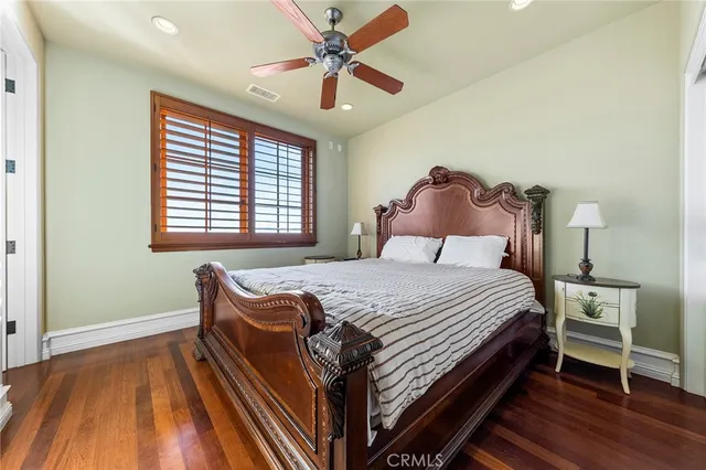 a large kitchen with a large counter top sink and stainless steel appliances