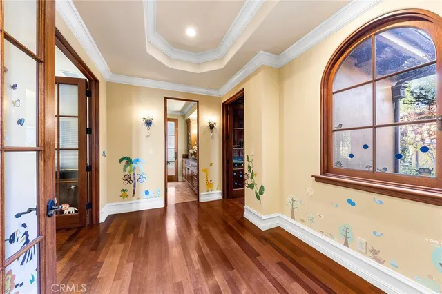 a view of walk in closet with clothes