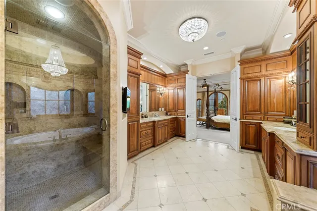 a view of living room kitchen with furniture and fireplace
