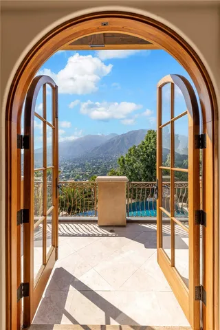 a view of a patio with a dining table and chairs