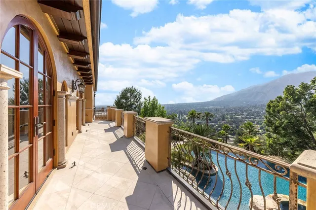 a view of a patio with table and chairs and potted plants