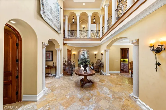 a living room with fireplace furniture and a large window