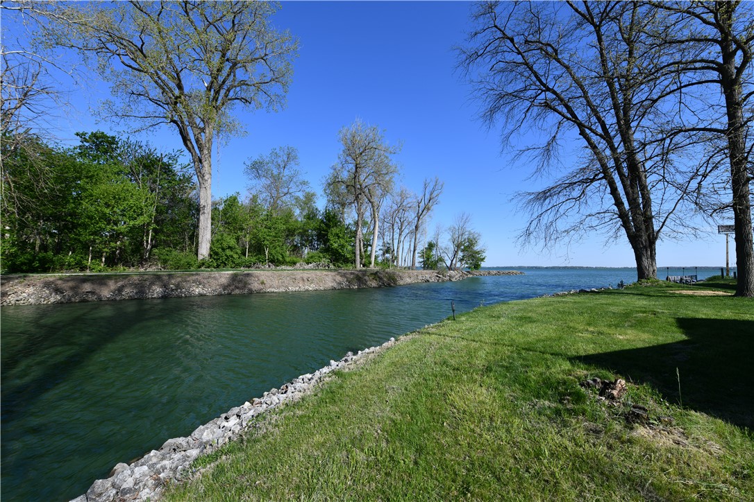 5445 Behm Road, Unit 15 Celina, OH 45822 - Photo 47 of 49 This tranquil waterfront setting offers direct access to the lake, surrounded by lush greenery.