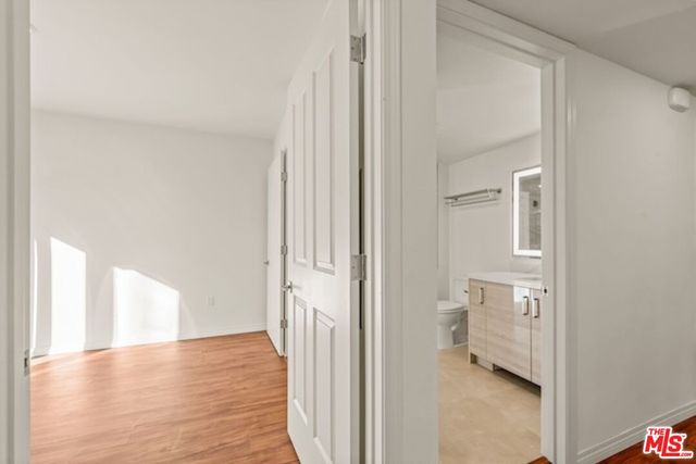 a view of a bathroom from a hallway