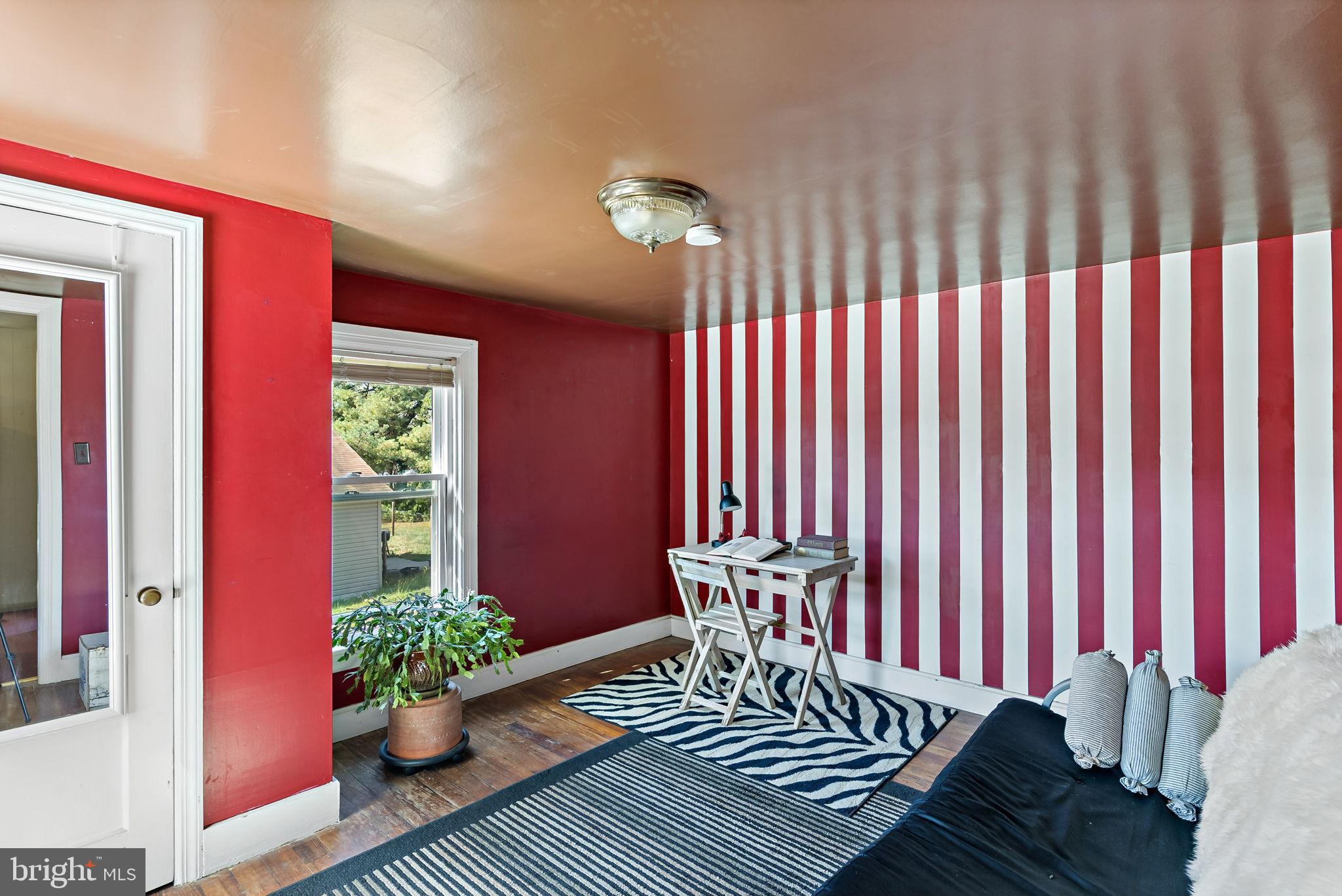 9157 Williamsport Pike Falling Waters, WV 25419 - Photo 11 of 51 a view of a dining room with furniture and a potted plant