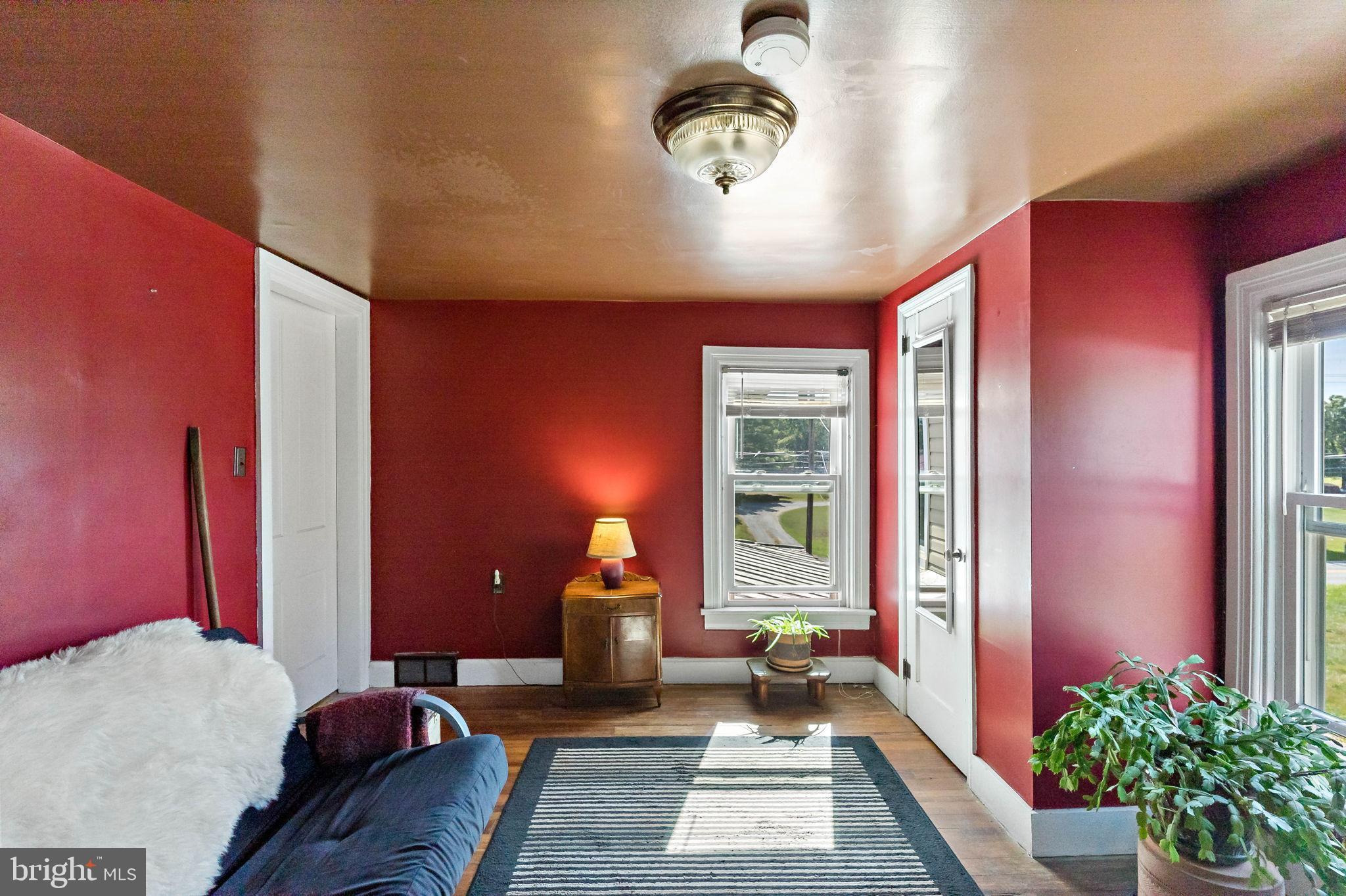 9157 Williamsport Pike Falling Waters, WV 25419 - Photo 13 of 51 a bedroom with furniture and a large window