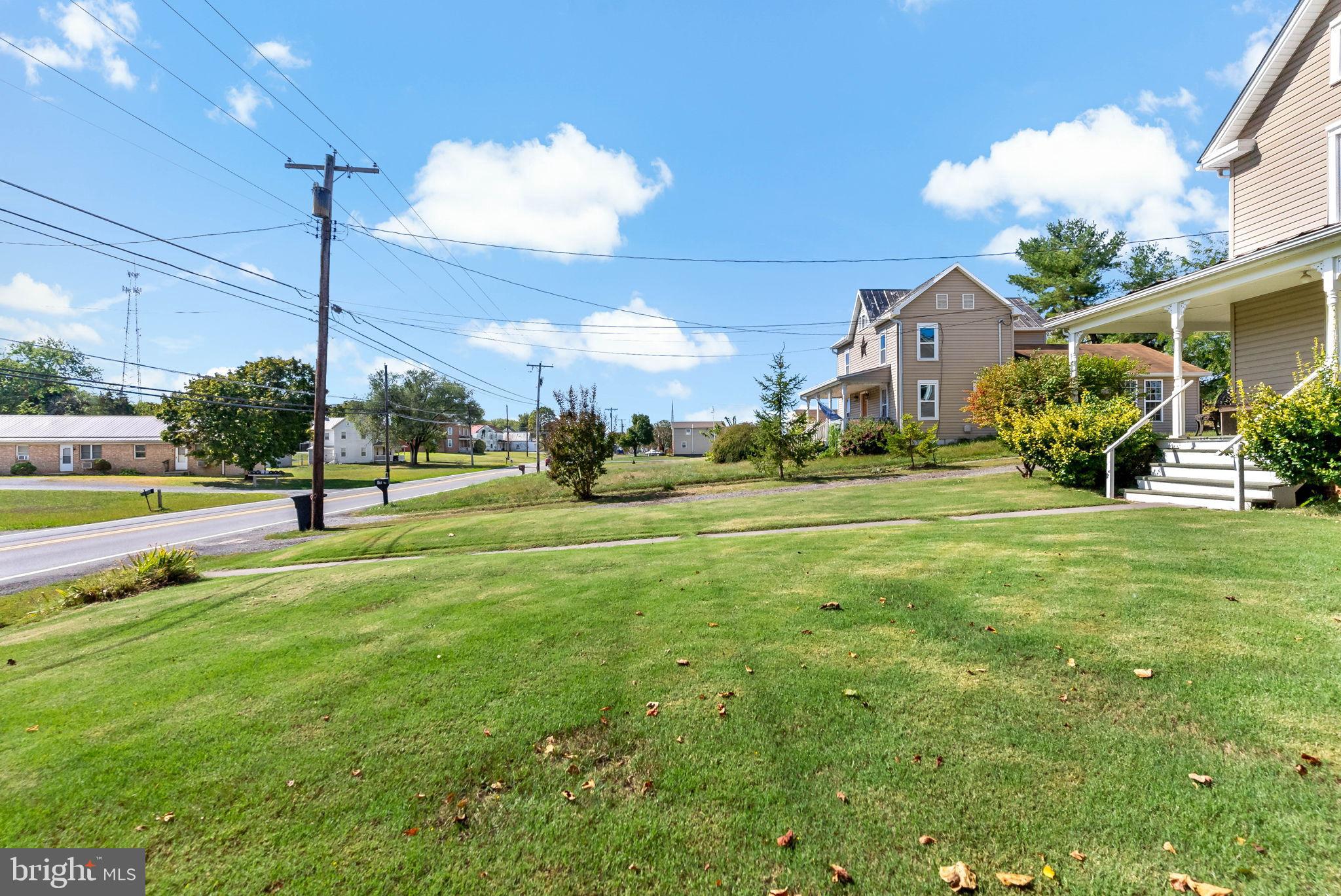 9157 Williamsport Pike Falling Waters, WV 25419 - Photo 29 of 51 a view of a house with a big yard and potted plants
