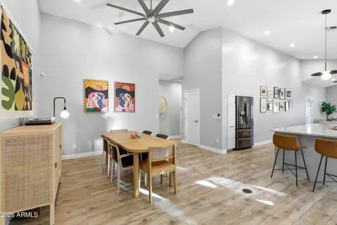 a dining room with furniture and wooden floor