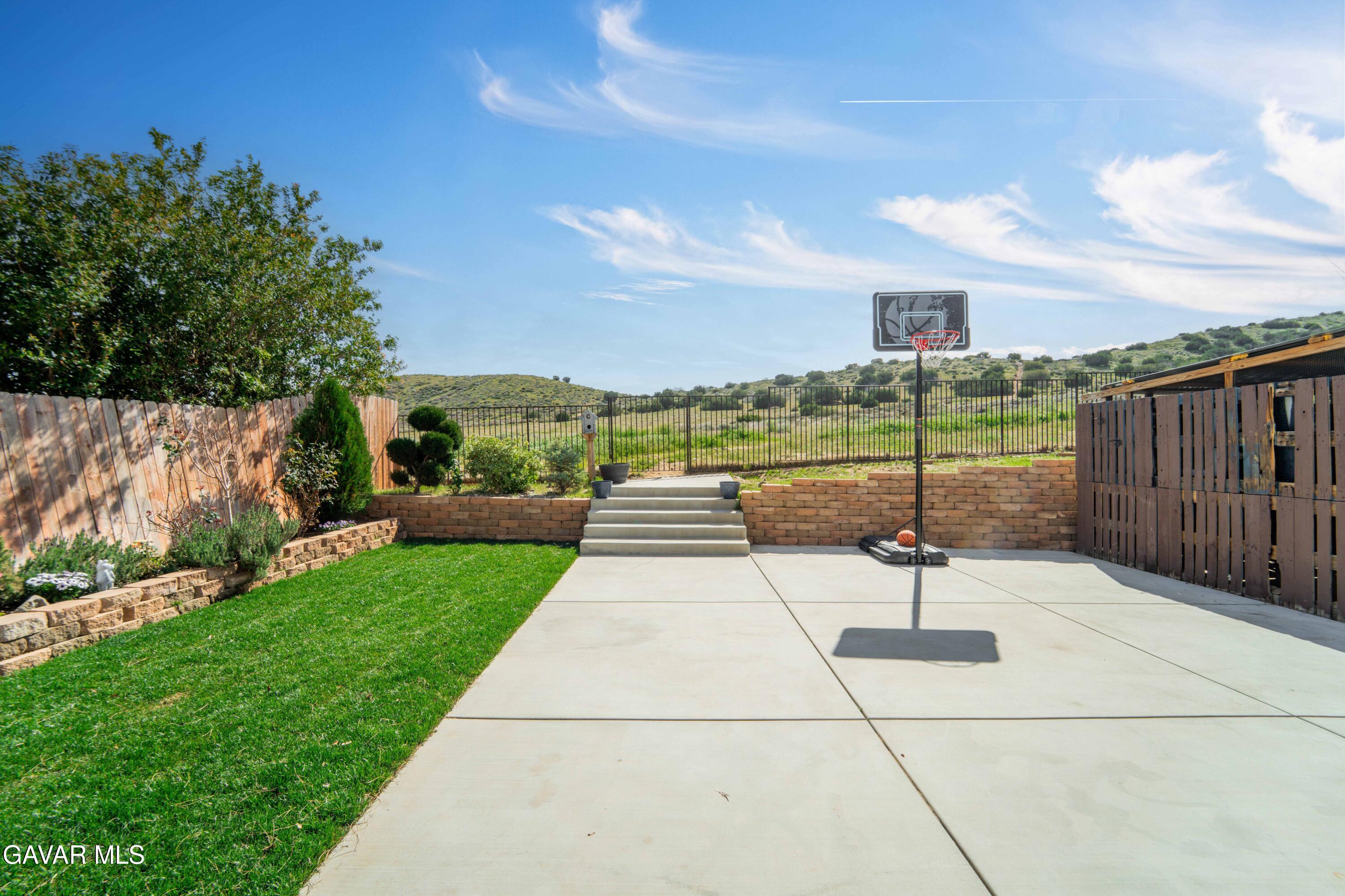 3046 Hampton Road Palmdale, CA 93551 - Photo 11 of 27 a view of a street with a yard