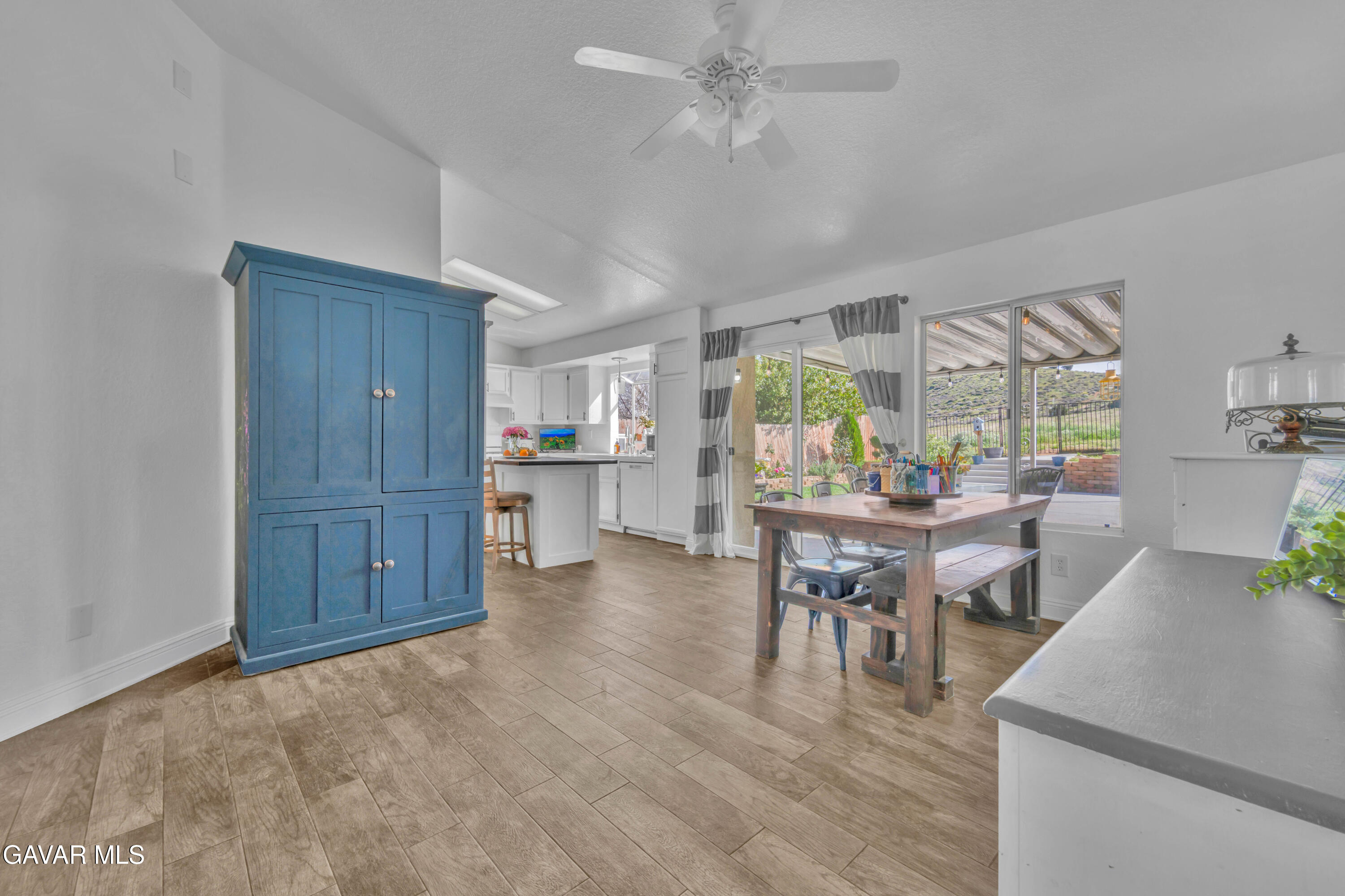 3046 Hampton Road Palmdale, CA 93551 - Photo 14 of 27 a view of a dining room with furniture window and wooden floor