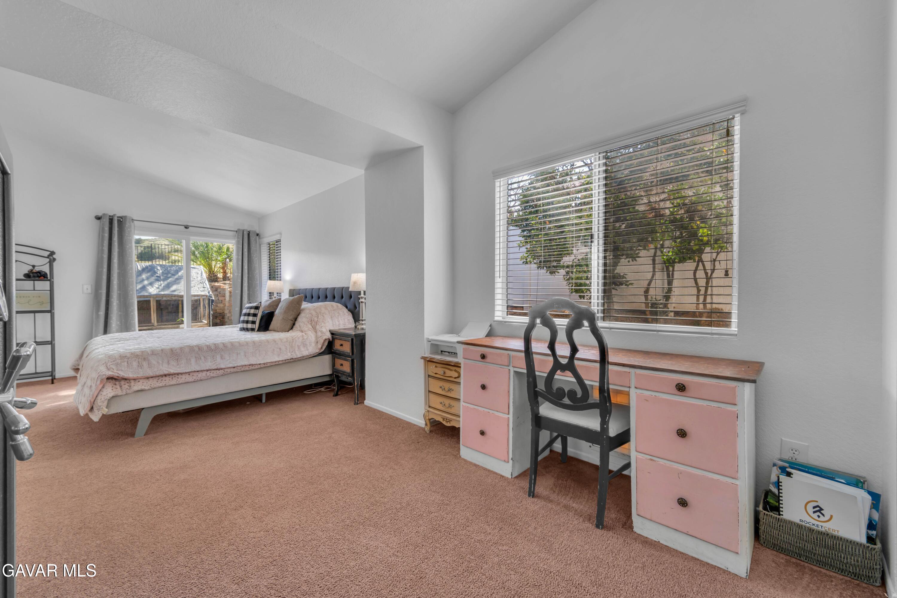 3046 Hampton Road Palmdale, CA 93551 - Photo 18 of 27 a bedroom with a bed and a large window