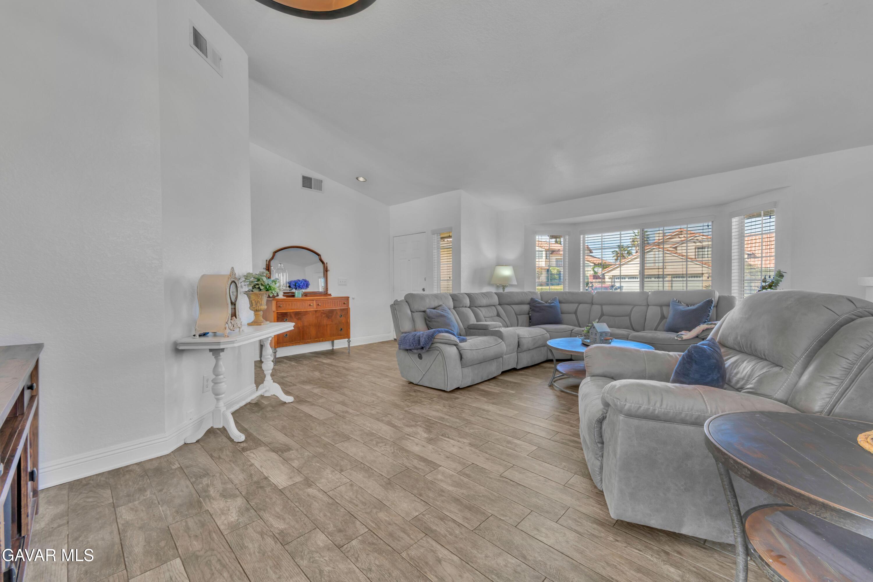 3046 Hampton Road Palmdale, CA 93551 - Photo 2 of 27 a living room with furniture and a window
