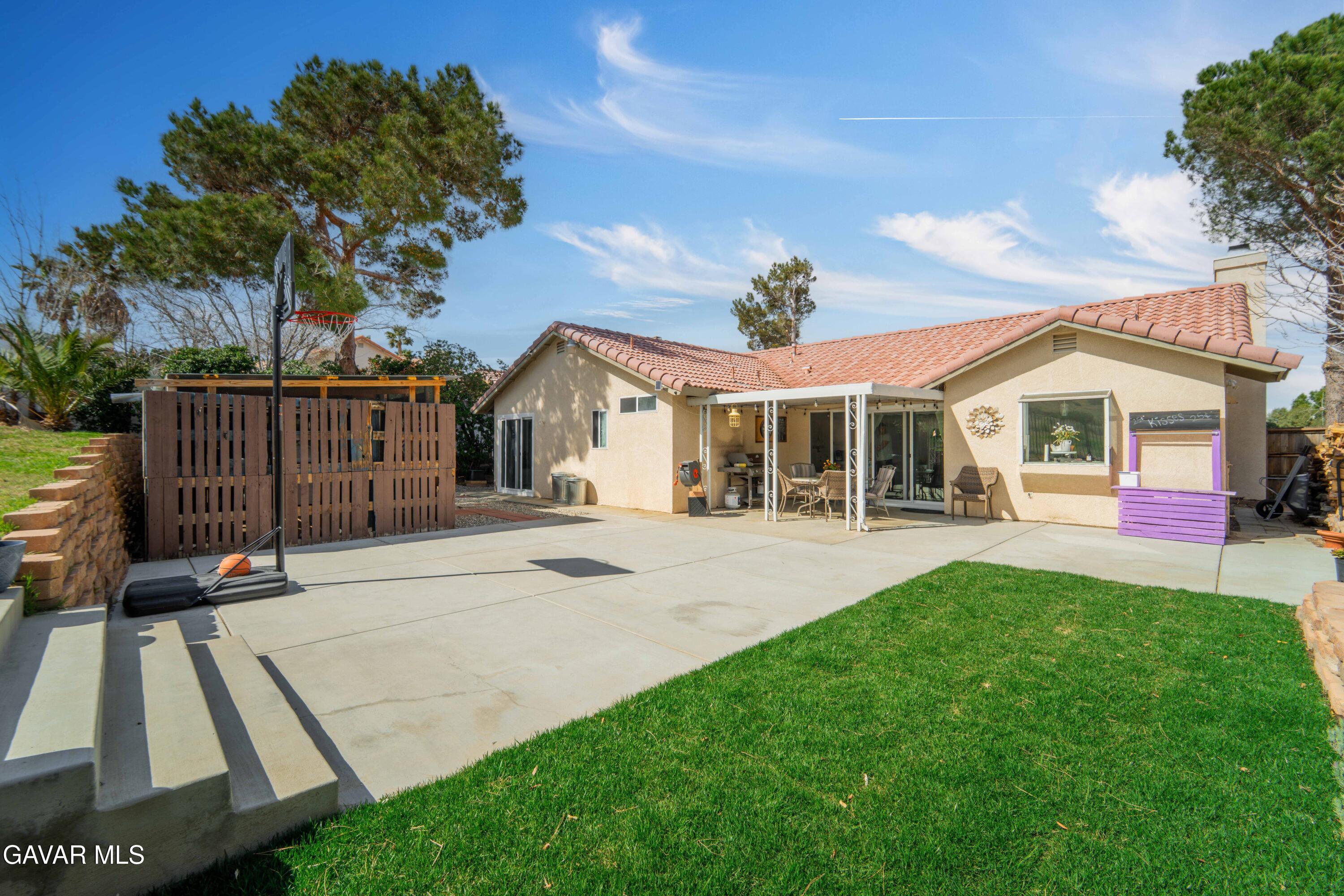 3046 Hampton Road Palmdale, CA 93551 - Photo 21 of 27 a front view of a house with a yard