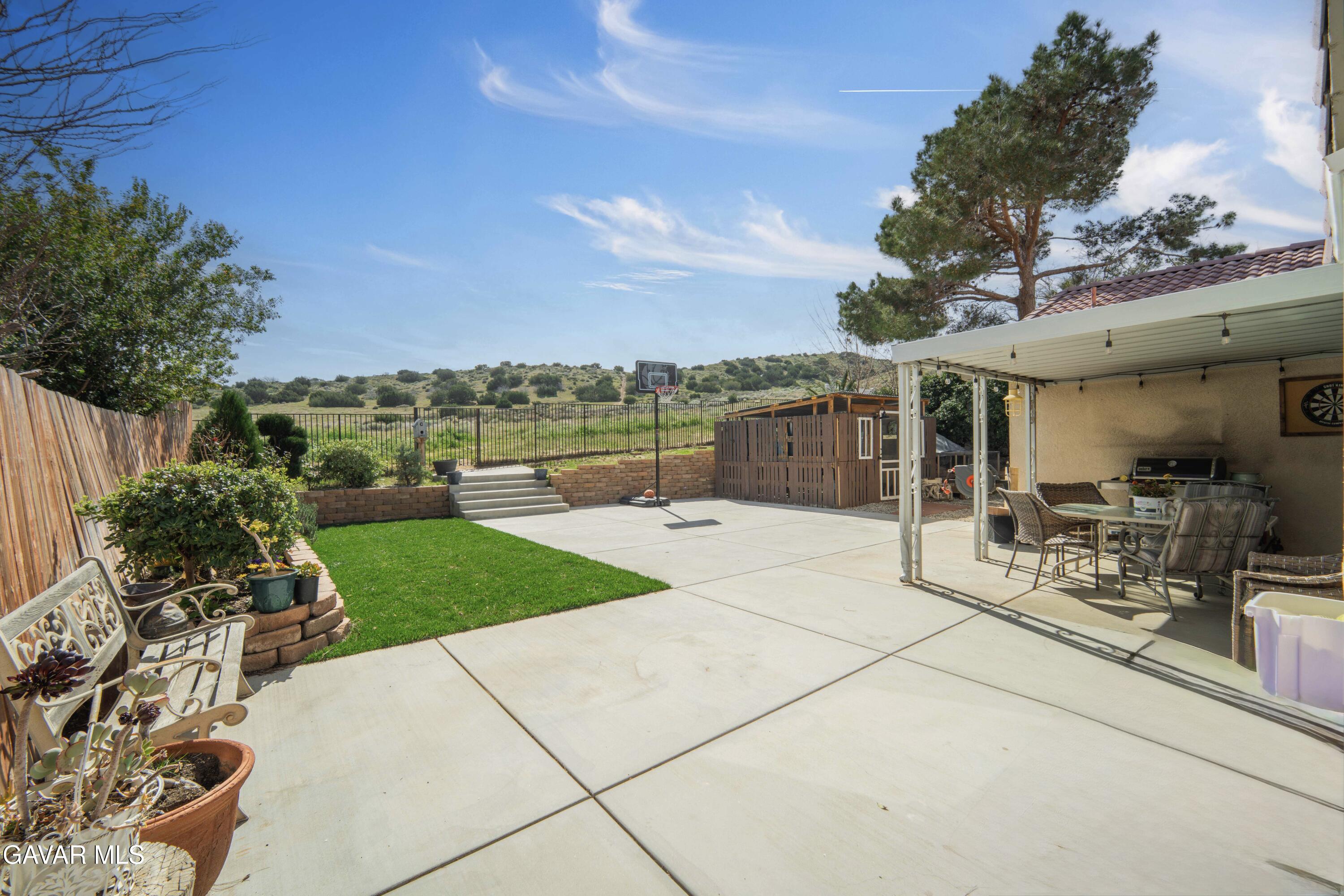 3046 Hampton Road Palmdale, CA 93551 - Photo 22 of 27 a view of a backyard with sitting area