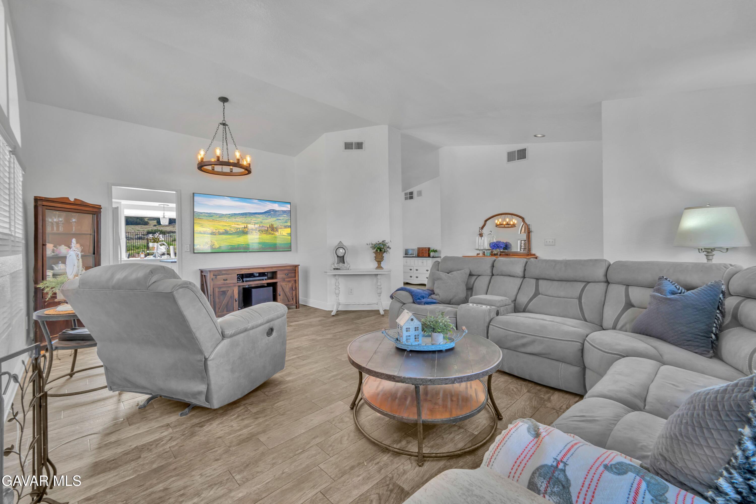 3046 Hampton Road Palmdale, CA 93551 - Photo 3 of 27 a living room with furniture and a table