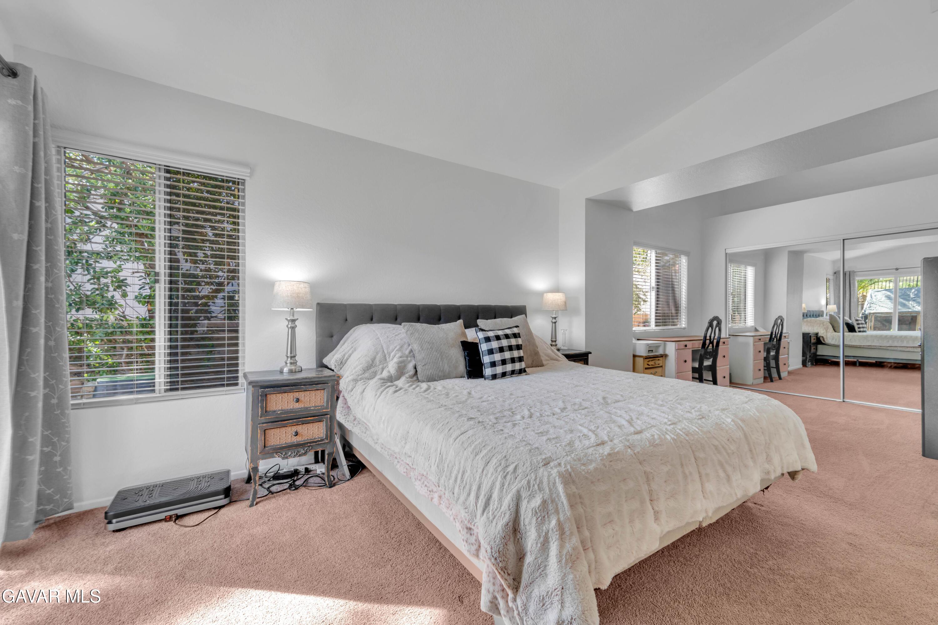 3046 Hampton Road Palmdale, CA 93551 - Photo 6 of 27 a bedroom with a bed a table window and a television