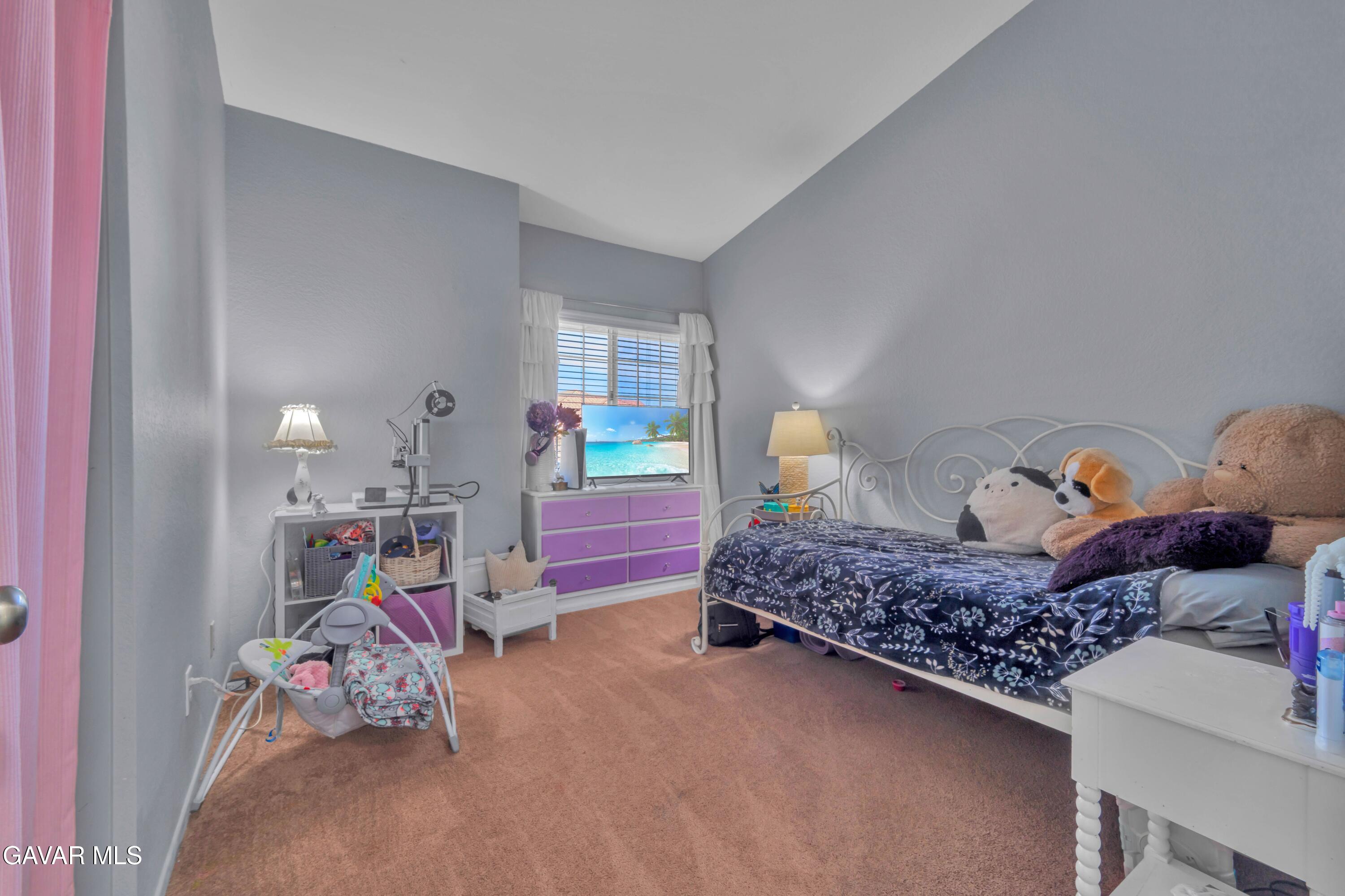 3046 Hampton Road Palmdale, CA 93551 - Photo 7 of 27 a bedroom with a bed and window