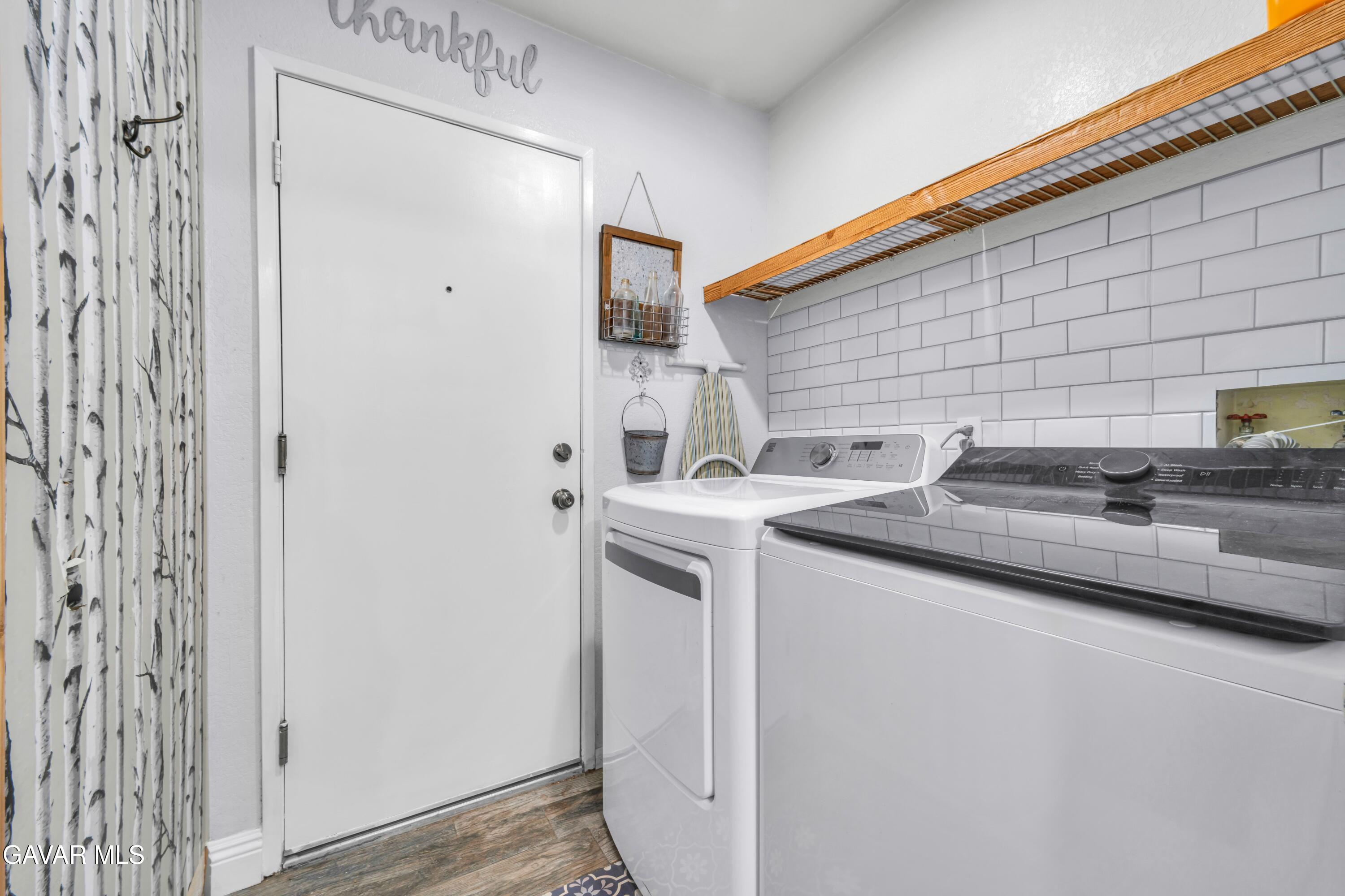 3046 Hampton Road Palmdale, CA 93551 - Photo 10 of 27 a kitchen with stainless steel appliances granite countertop a sink and cabinets