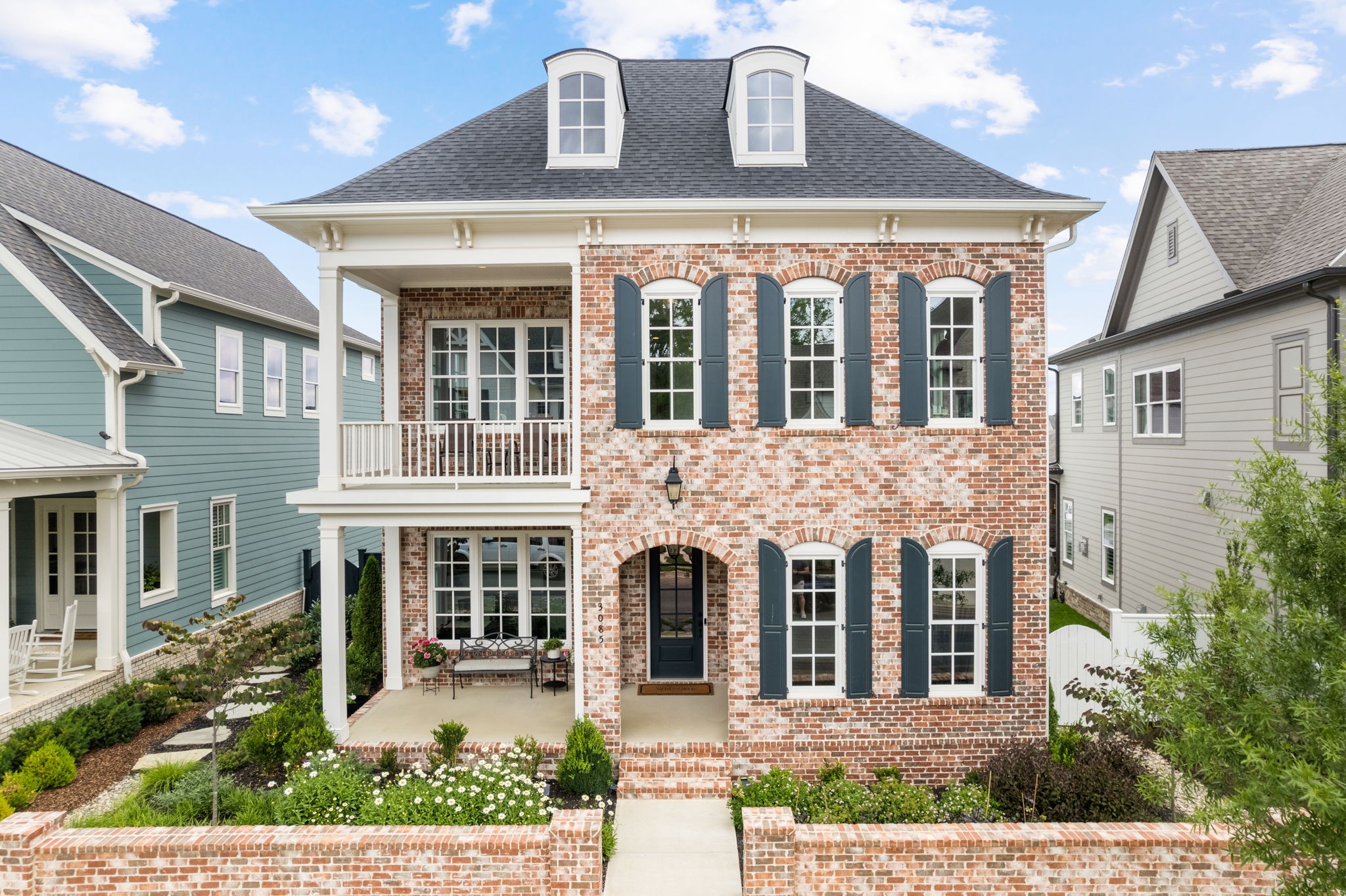 front view of a house with a yard