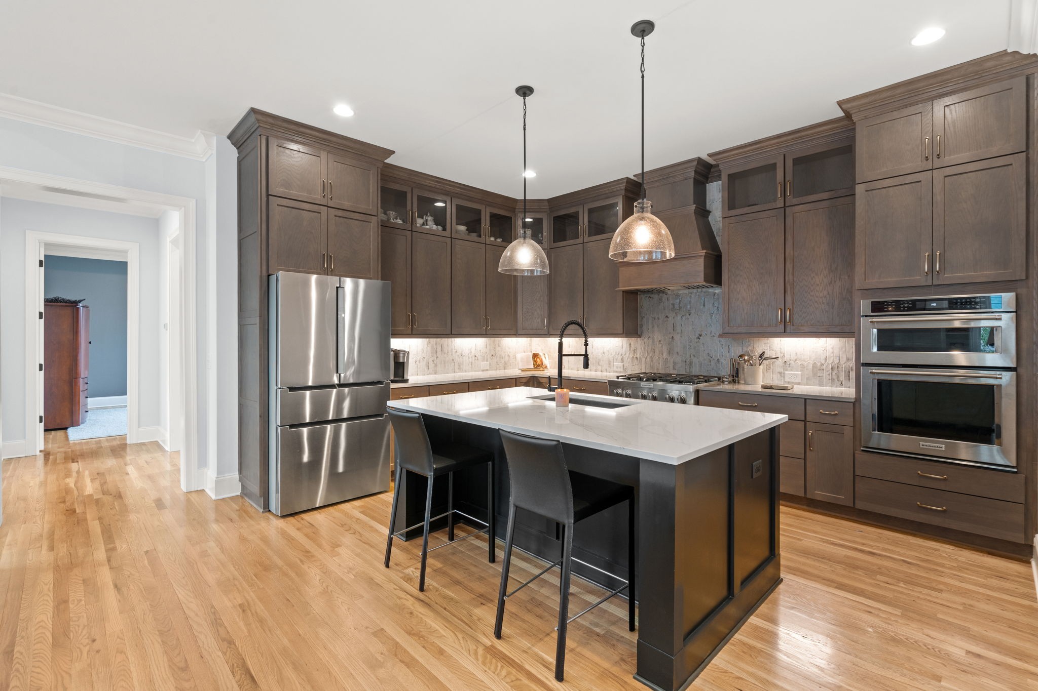 3085 Conar Street Franklin, TN 37064 - Photo 19 of 55 a kitchen with stainless steel appliances granite countertop a stove a refrigerator a kitchen island a sink and a wooden floors