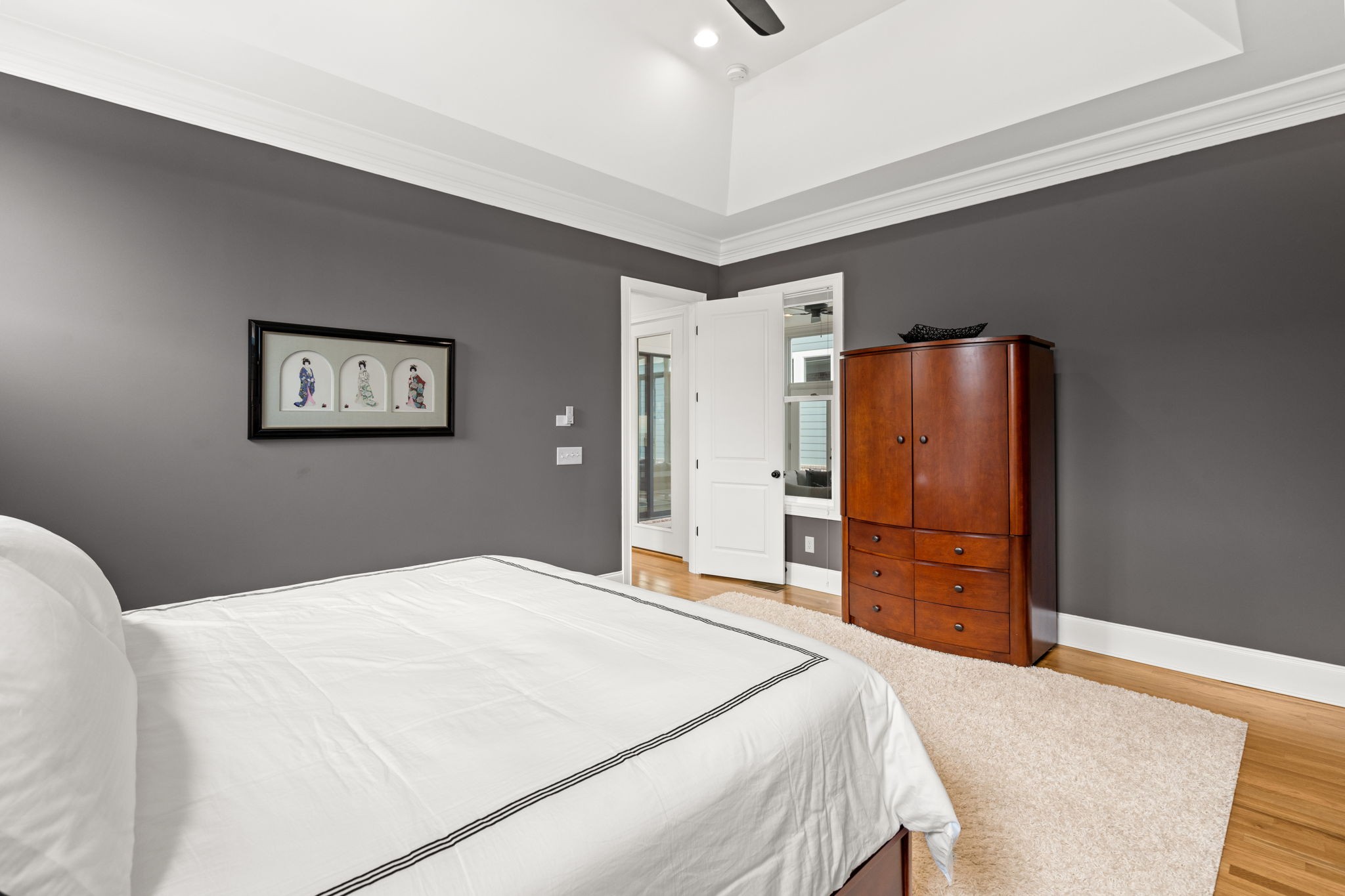 3085 Conar Street Franklin, TN 37064 - Photo 24 of 55 a bedroom with a large bed and a chandelier