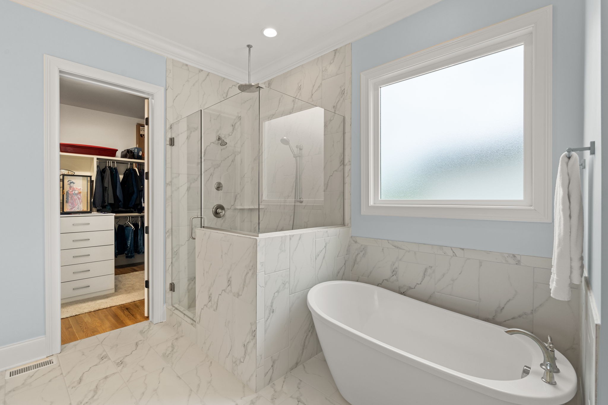 3085 Conar Street Franklin, TN 37064 - Photo 26 of 55 a bathroom with a white bath tub a mirror and a shower