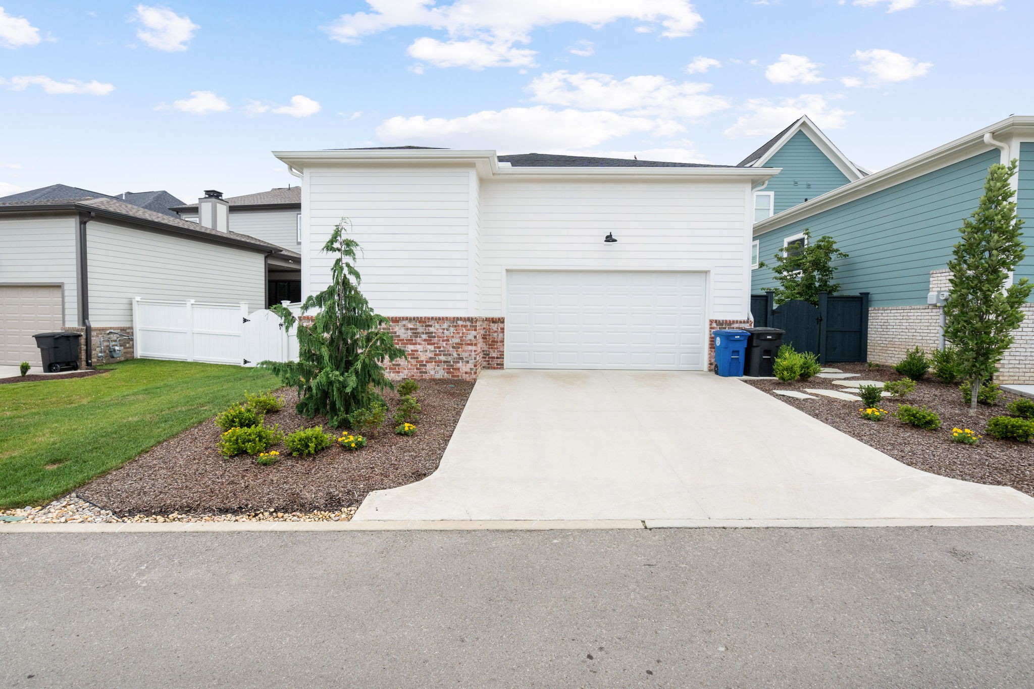 3085 Conar Street Franklin, TN 37064 - Photo 47 of 55 a view of a white house with a yard and plants