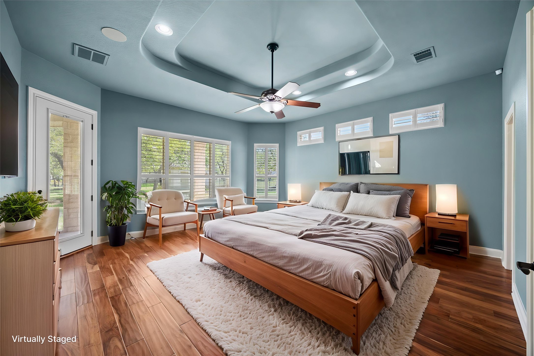 112 Shady Elm Georgetown, TX 78633 - Photo 12 of 31 a spacious bedroom with a large bed and a chandelier