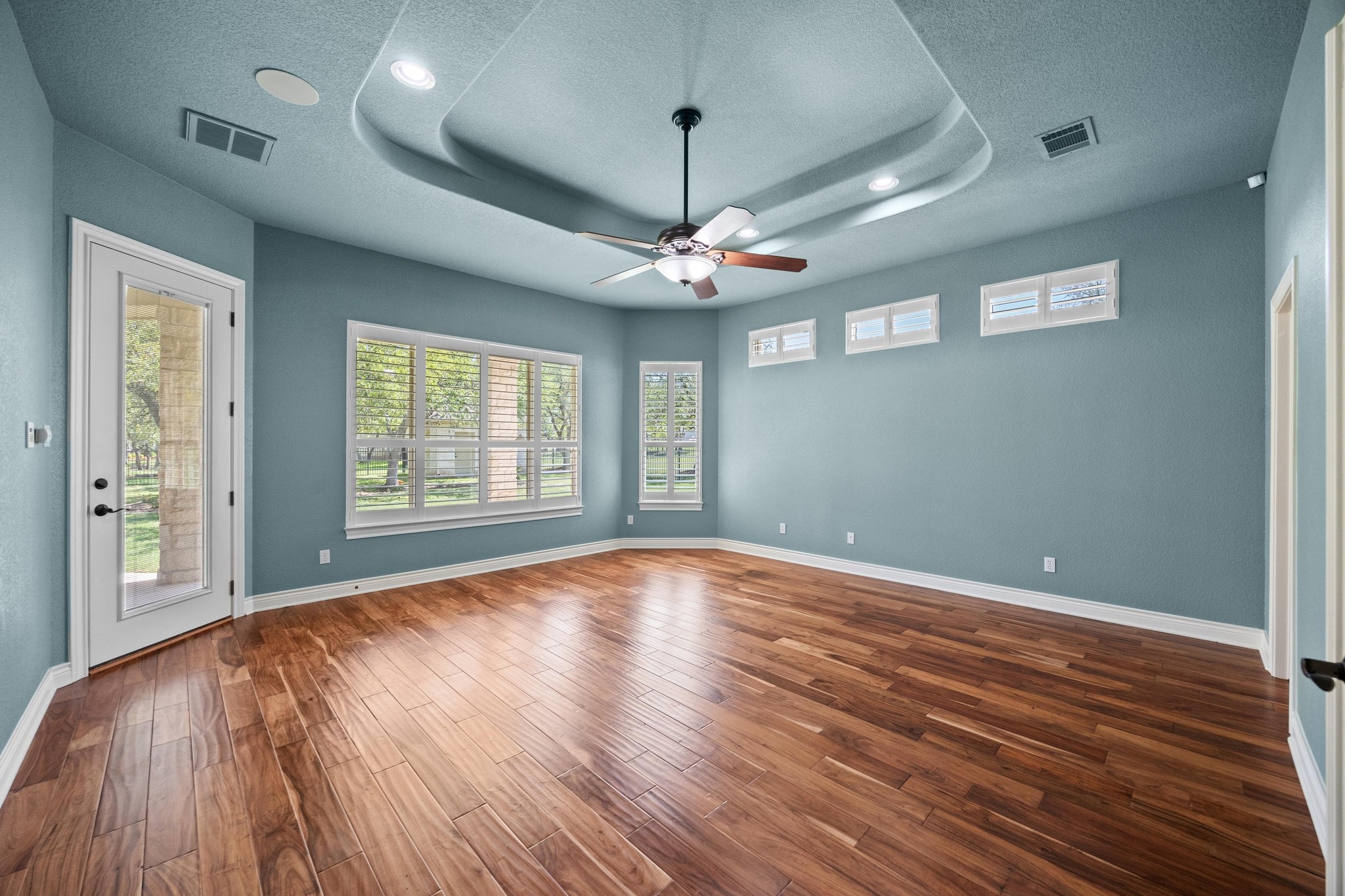 112 Shady Elm Georgetown, TX 78633 - Photo 13 of 31 a view of an empty room with window and wooden floor