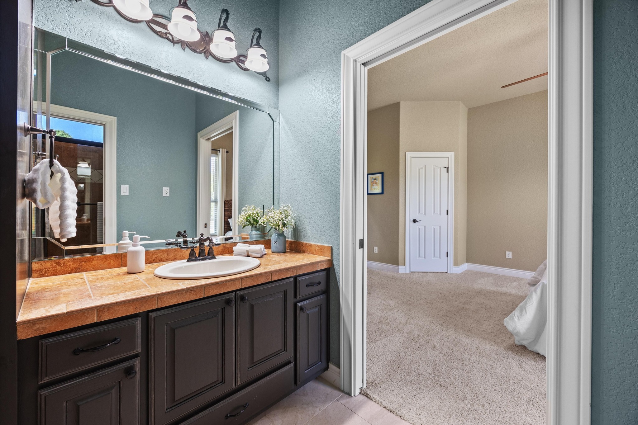 112 Shady Elm Georgetown, TX 78633 - Photo 24 of 31 a bathroom with a sink double vanity granite and a mirror