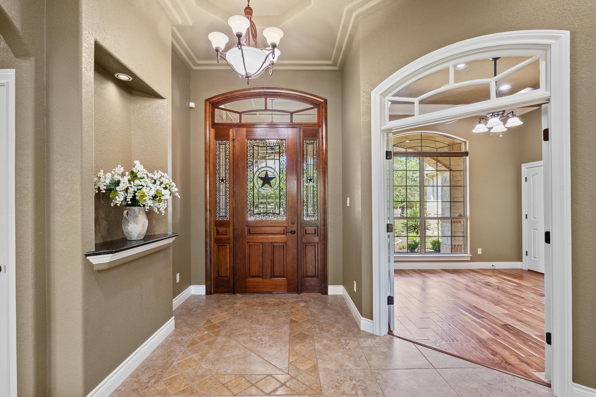 112 Shady Elm Georgetown, TX 78633 - Photo 4 of 31 a view of an entryway with a chandelier