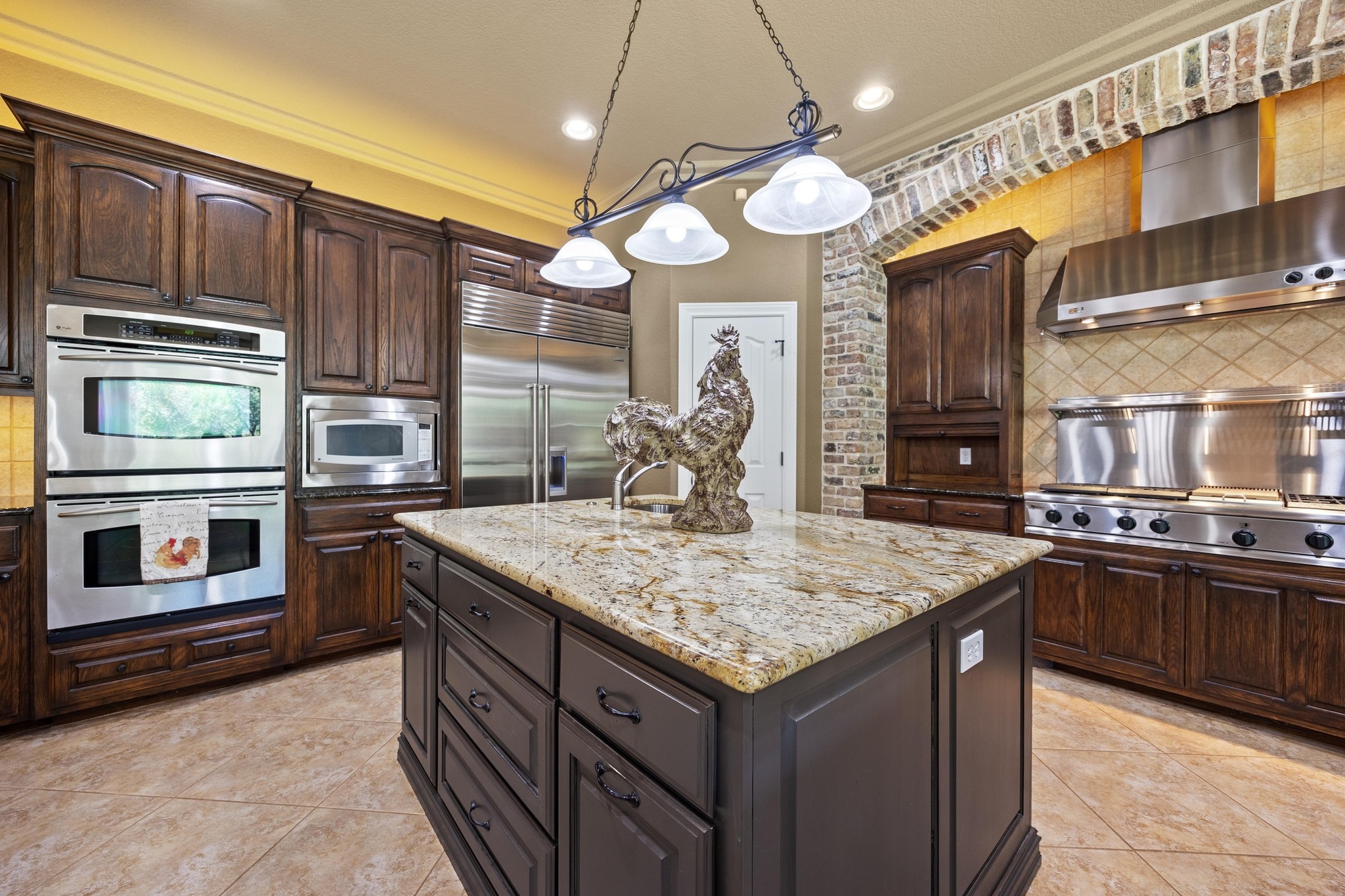 112 Shady Elm Georgetown, TX 78633 - Photo 10 of 31 a kitchen with stainless steel appliances granite countertop a stove and a sink