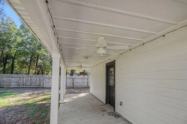 a view of a porch with wooden walls