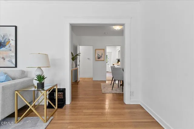 a view of a livingroom with furniture and wooden floor