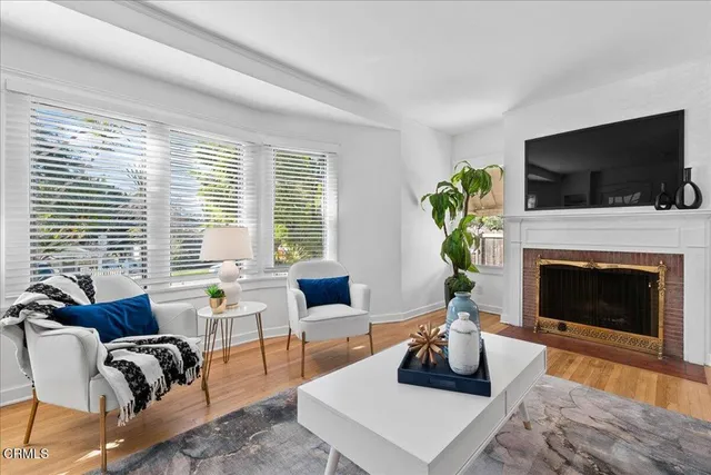 a living room with furniture and a lamp