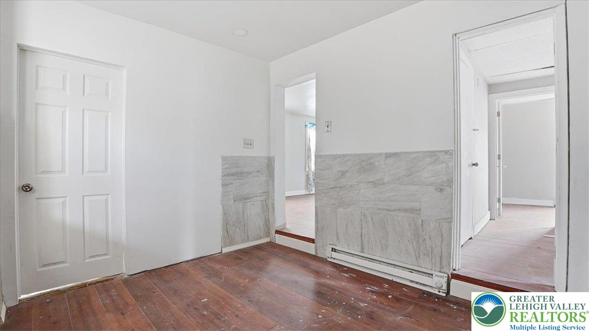 202 North Courtland Street, Unit 1 & 2 East Stroudsburg, PA 18301 - Photo 15 of 49 an empty room with wooden floor