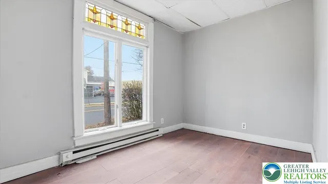 a view of an empty room with a window