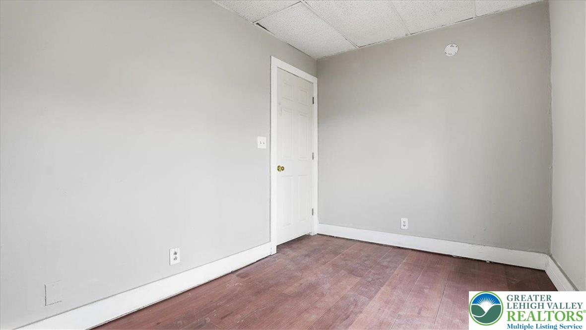 202 North Courtland Street, Unit 1 & 2 East Stroudsburg, PA 18301 - Photo 17 of 49 an empty room with wooden floor