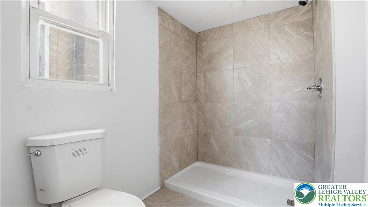 202 North Courtland Street, Unit 1 & 2 East Stroudsburg, PA 18301 - Photo 21 of 49 a bathroom with a toilet and bathtub