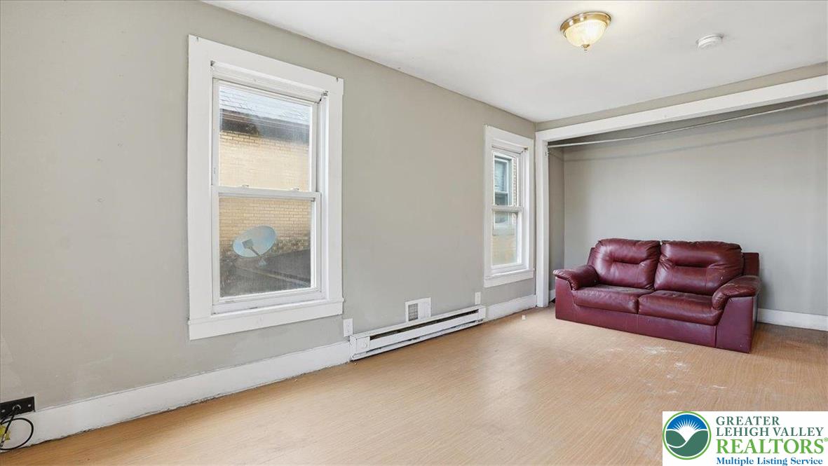 202 North Courtland Street, Unit 1 & 2 East Stroudsburg, PA 18301 - Photo 23 of 49 a living room with furniture and a window