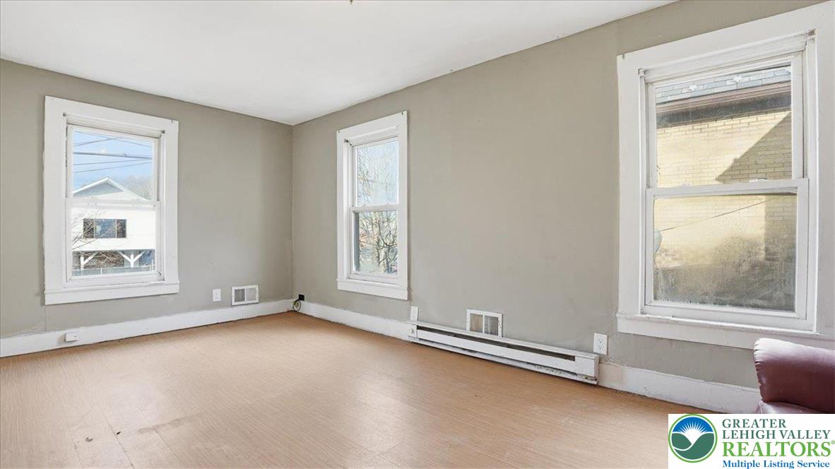 202 North Courtland Street, Unit 1 & 2 East Stroudsburg, PA 18301 - Photo 24 of 49 an empty room with windows