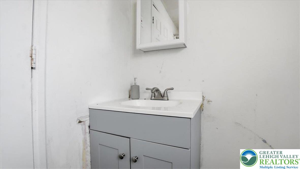 202 North Courtland Street, Unit 1 & 2 East Stroudsburg, PA 18301 - Photo 34 of 49 a bathroom with a sink and a mirror